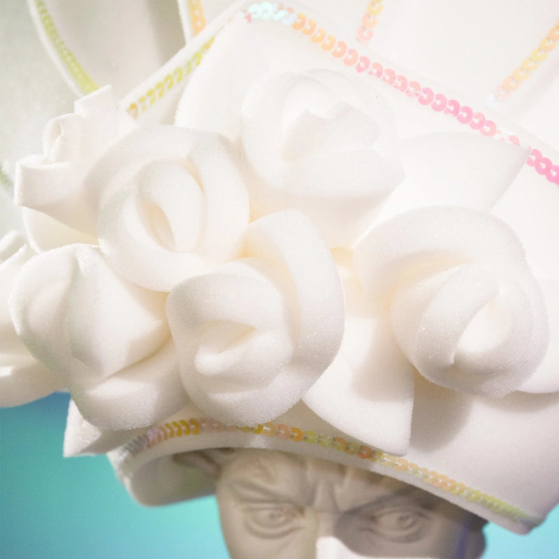 Giant foam rubber crown with white flowers and girlfriends